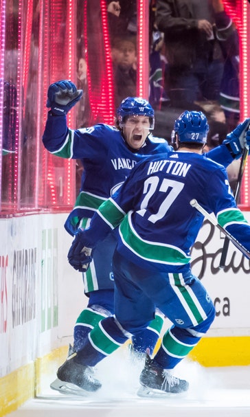 Pouliot caps Pettersson’s big night, Canucks beat Avs in OT